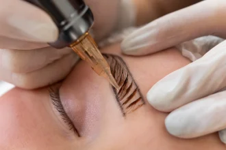 beautician-doing-microblading-procedure-client-s-eyebrows